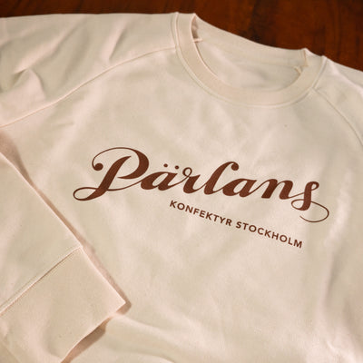 En mjuk sweatshirt med Pärlans logga!